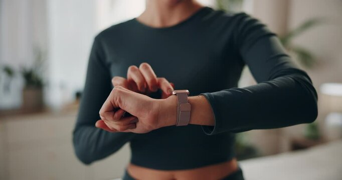 Hands, woman and home with digital watch on checking or tracking health progress. Female person, closeup and fitness app on yoga for exercise, workout and healthy in living room for self care