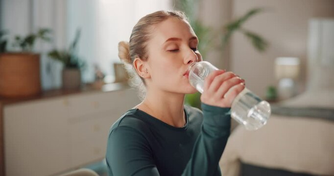 Woman, home and yoga with drinking water for hydration, thirst and health with exercise. Female person, liquid bottle and tired on break with workout for fitness for self care, wellness and detox