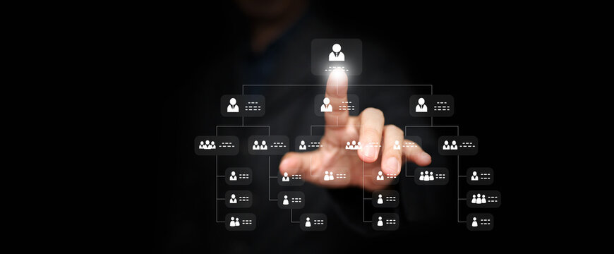 Hierarchy structure  concept. Businessman tapping at organization chart as a virtual interface screen. Company or business hierarchical organizational chart of staff and employees