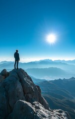 Person looking out at the horizon from a mountain peak, ready for new challenges