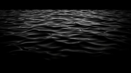 Calm black water surface with gentle ripples reflecting light. Perfect for backgrounds or abstract designs.