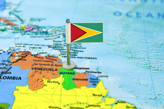 Guyana flag on the map with selective focus and shallow DOF