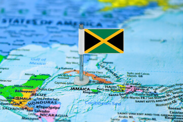 Jamaica flag on a map. Close-up image.