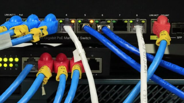 cable network , fiber optic cable connected to switch port in server room, Concept network management