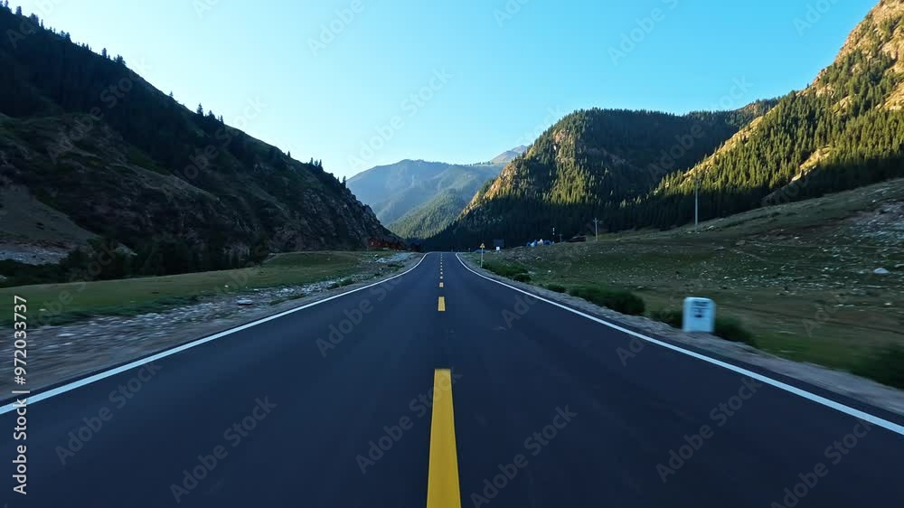 Wall mural driving car on a mountain road. road trip.