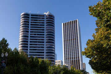 Modern architecture tall skyscraper building exterior design with nice patterns, windows, and details. Located in Downtown Portland, Oregon. High quality picture for download