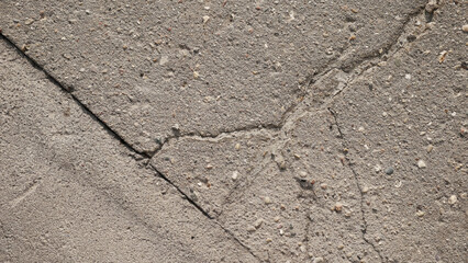 Obraz premium The texture of cracked street asphalt