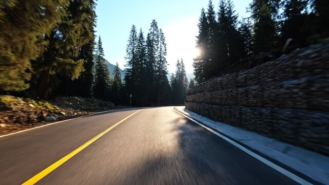 Driving car on a mountain road. road Trip. car driving through green forest.