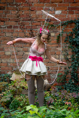 A girl with an original Halloween costume made by herself is ready to celebrate. Conceptual social...