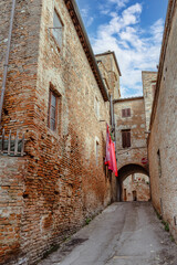 ?obblestone streets of Certaldo, surrounded by medieval architecture. Certaldo, province of Florence, Italy