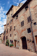 Сobblestone streets of Certaldo, surrounded by medieval architecture. Certaldo, province of Florence, Italy