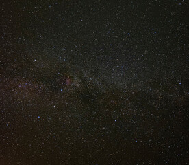 The milky way galaxy is shining brightly in the dark night sky, full of bright stars