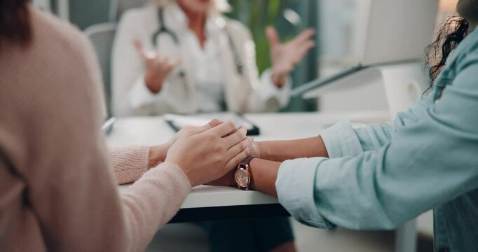 Patient, doctor appointment and holding hands for news in hospital office, results and support. Women, medical checkup and insurance for test at gynecologist, lgbtq couple and fertility or ivf choice