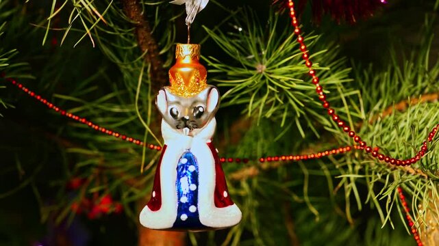 Queen of mouses. Christmas tree, toy decorations. New Year and Merry Christmas. Smooth camera movement on the slider. Video postcard. Live christmas tree with garlands and toys