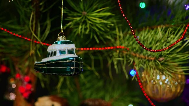 Boat, ship, yacht, cruise. Christmas tree, toy decorations. New Year and Merry Christmas. Smooth camera movement on the slider. Video postcard. Live christmas tree with garlands and toys