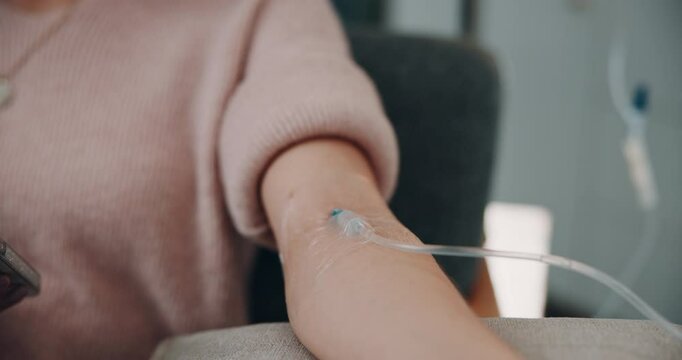 Arm, vitamins and woman on iv drip in clinic for healthcare treatment, medication or healing. Medical checkup, infusion and patient in hospital office for wellness, nutrition or natural medicine.