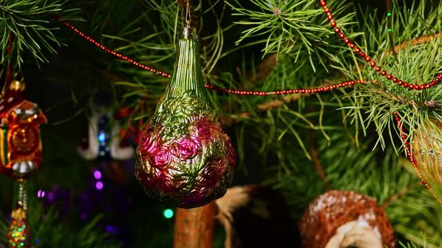 Roses, flowers. Christmas tree, toy decorations. New Year and Merry Christmas. Smooth camera movement on the slider. Video postcard. Live christmas tree with garlands and toys