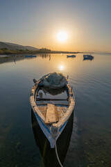 Obraz premium Fishermans boats in the Karina region near the Soke district of Aydin province Turkey are warmed by sunlight at sunrise