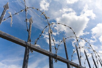 the barbed wire fence of protected prison territory
