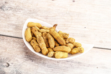 Raw ripe unpeeled peanut heap