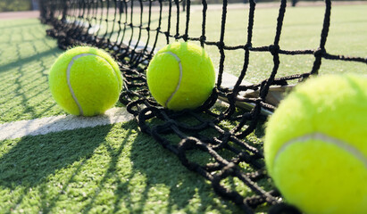 Closeup of the tennis ball on the net