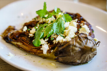 Grilled eggplant with curry, feta format and all black, Sant Cugat del Vallès, (Vallès Occidental), Catalonia, Spain