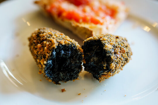 Squid ink croquettes, Sant Cugat del Vall&egrave;s, (Vall&egrave;s Occidental), Catalonia, Spain