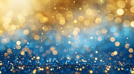 Elegant abstract background featuring blue and gold bokeh with sparkling light effects; defocused glittering particles create a festive, shimmering texture perfect for holiday designs and decorations