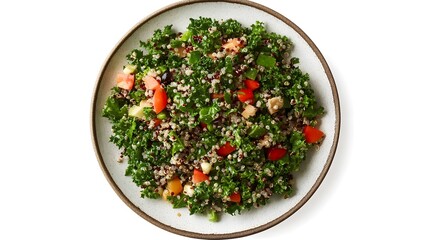 Vibrant quinoa salad with kale, cherry tomatoes, and fresh vegetables on white plate
