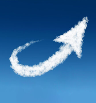 Arrow shaped cloud going upwards on blue sky
