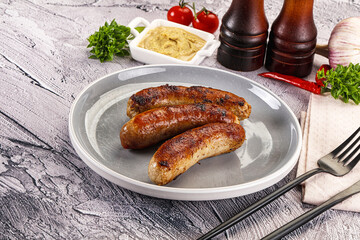 Delicous natural roasted sausages in the plate