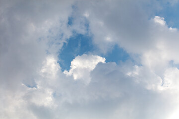 Clouds on the blue sky as a background