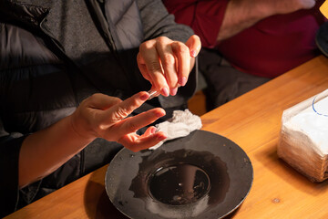 Tourists gold panning in Tankavaara Gold Village in Finland