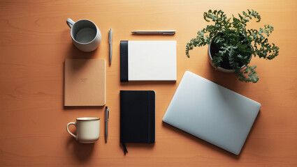 A flat lay of office essentials including a laptop, notebook, pen, coffee mug, and a plant, neatly arranged on a wooden desk for a productive workspace vibe