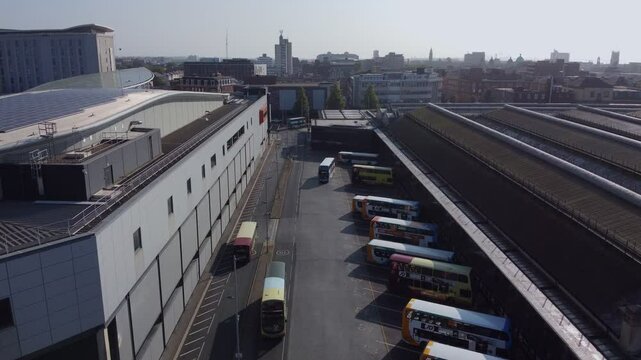 Drone 50fps. Busy UK bus station, stagecoach bus.