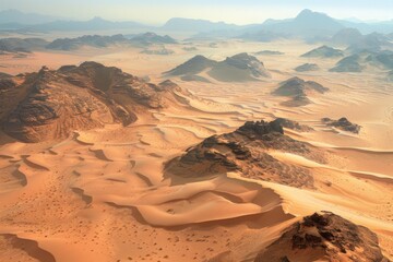 Fototapeta premium Aerial view of the desert landscape featuring sand dunes and mountains in the distance