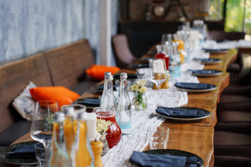 a served banquet table with gray plates and napkins