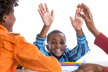Children sitting at a table with hands raised for attention, perfect for educational or training scenes