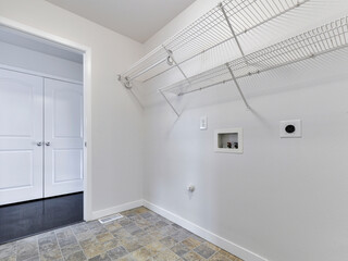 Modern residential empty laundry room interior