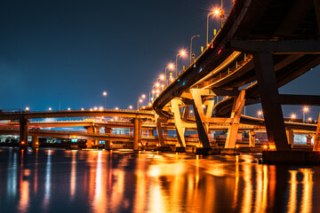 Curved Expressway at Night with Reflections on...