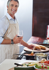 Cooking, portrait and food with man in kitchen for healthy lunch, vegetables and eating. Wellness, nutrition and diet with person and pasta ingredients in home for homemade meal, wine and dinner