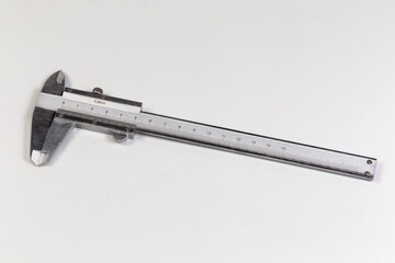 Vernier caliper with metric scales on a gray background