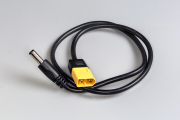 Power cable-adapter with flat and coaxial connectors on edges