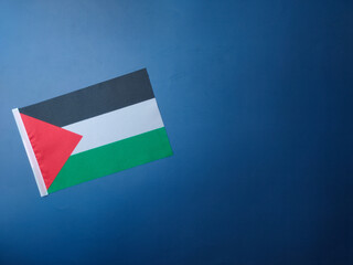 Top view palestine flag on a blue background with copy and text space