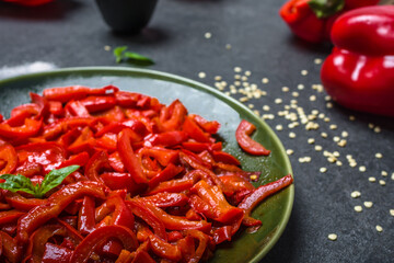 Grilled vegetables. Plate with grilled paprika stripes on dark background. Healthy food concept.