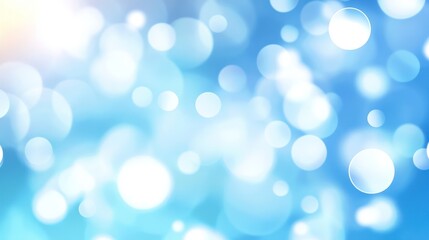 A serene blue background adorned with soft, circular bokeh, creating a dreamy and calming atmosphere.