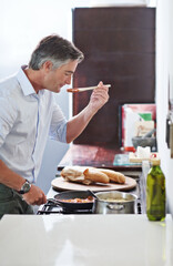 Cooking, taste and food with man in kitchen for healthy lunch, vegetables and eating. Wellness, nutrition and diet with person and ingredients in home for homemade meal, detox and organic dinner