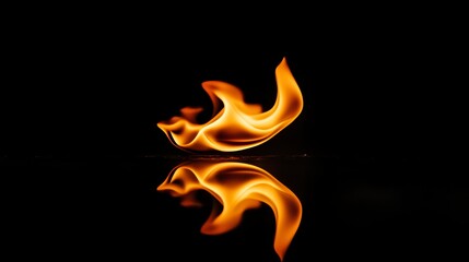 A single flame reflecting on a dark surface.