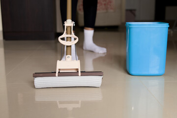 Close Up of Floor Cleaning with Blue Mop Bucket