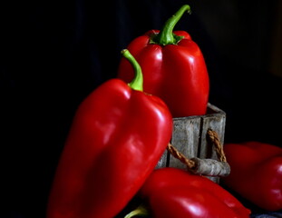 red peppers on a black background